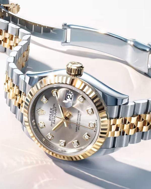 Close-up of a two-tone Rolex Lady-Datejust with a pale dial