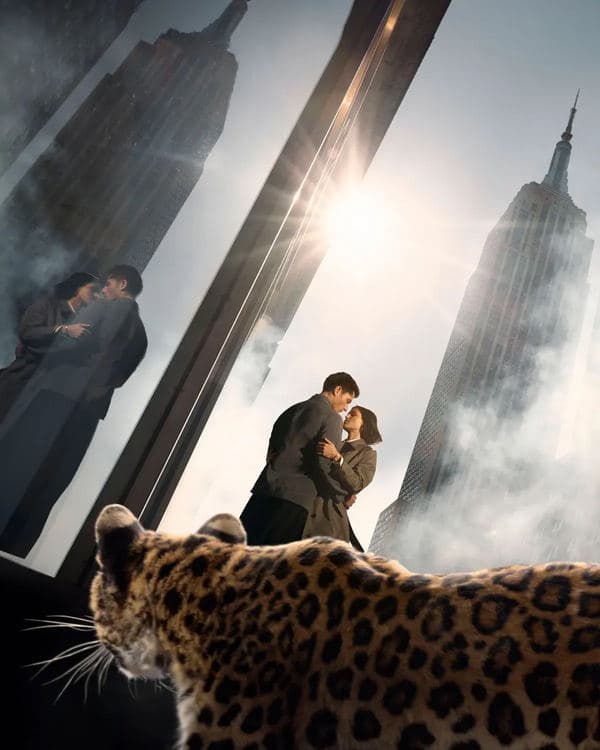 Couple embracing beside skyscraper windows with a leopard in the Cartier Love Unlimited campaign
