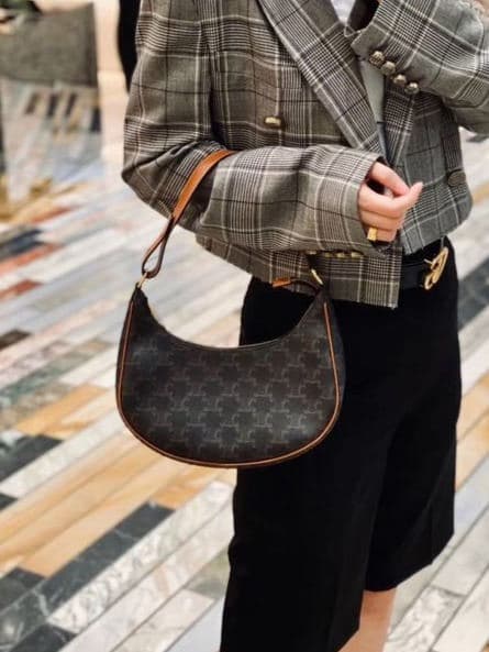 Celine Ava shoulder bag with Triomphe pattern worn with a grey plaid blazer