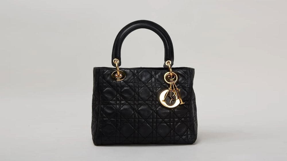 Black Lady Dior front view with Cannage quilting and gold D.I.O.R. charms