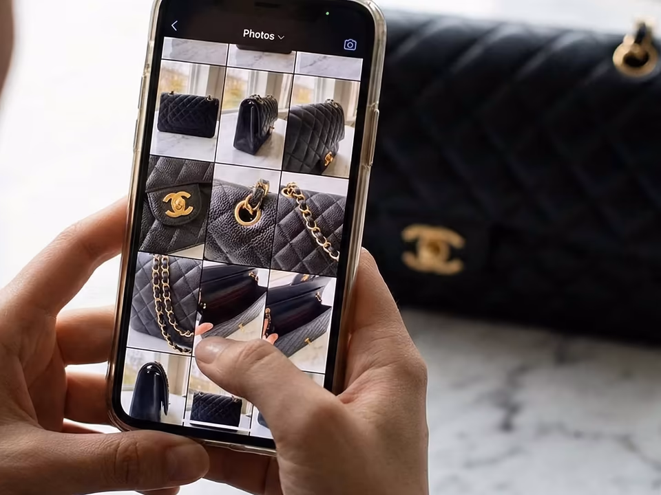 Selecting detailed handbag photos on a phone